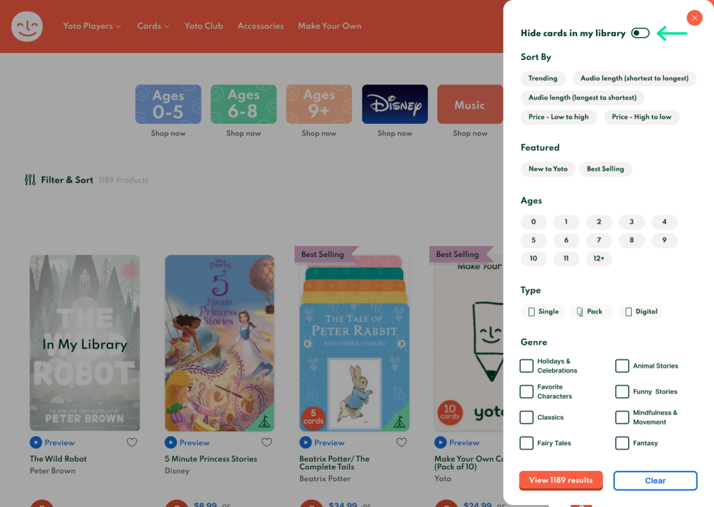 The Yoto e-commerce store with their "Filter and Sort" drawer menu open. A green arrow points to a "Hide cards in my library" toggle that is slightly lower than previously and in a heavier font.